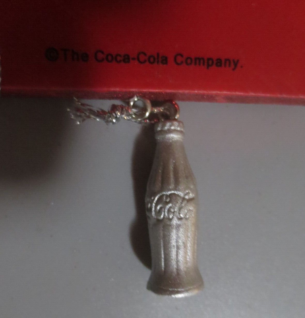 Primary image for Coca-Cola SIGN 1 BOTTLE DANGLE ORNAMENT - HAD 3  - SOME GLITTERS OFF  AS IS