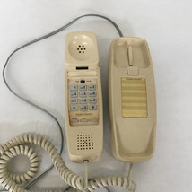 Vintage trim line push button touch tone telephone long cord wall mountable - $365.13 MXN