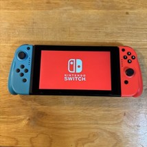 Nintendo Switch System with Neon Blue Red Joy-Con and Accesories Great Used Cond - $262.35