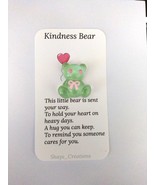 Green resin bear with pink eyes and a pink ribbon, Pocket Hugs - $111.65 MXN