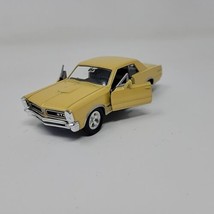 Welly 1965 Pontiac GTO 42313 NEW Metallic Gold 1:43 Scale Diecast Model Car - $15.88