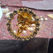 Vintage gold tone cherub ring of rhinestones brooch - $10.80