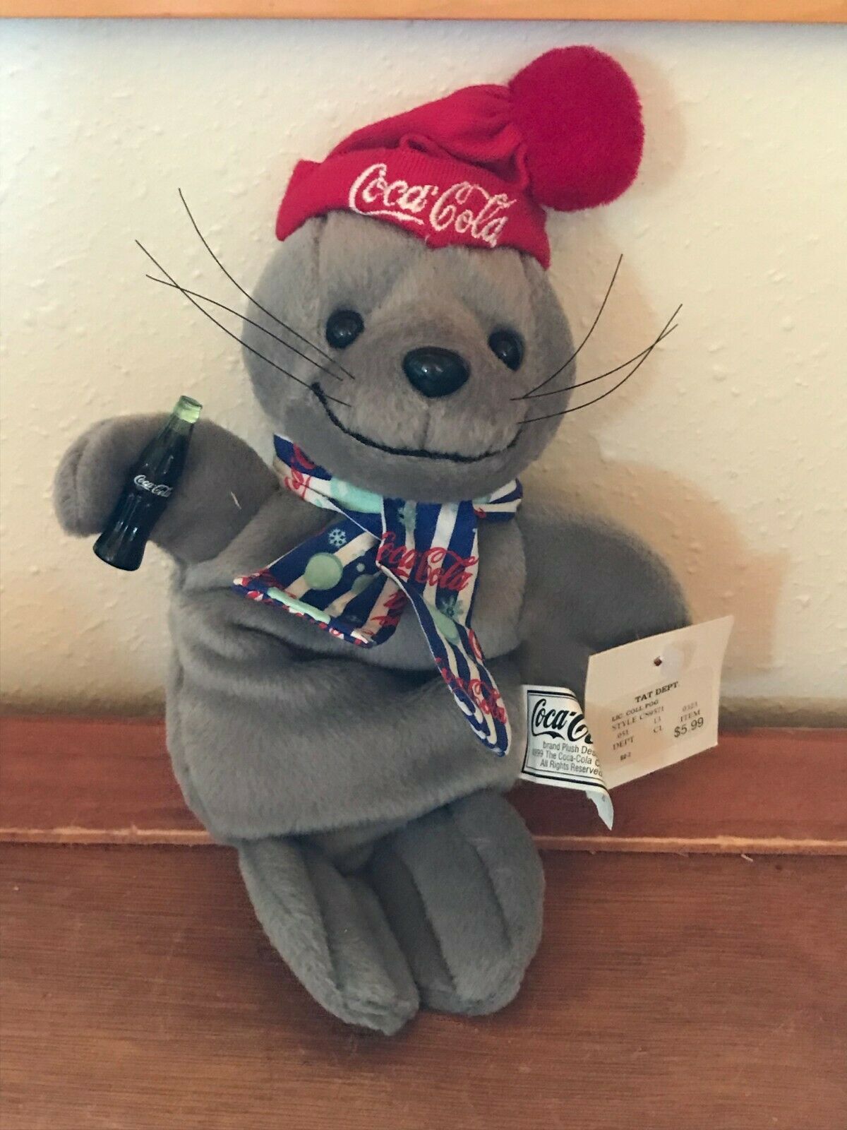 Primary image for Gently Used Plush Coca Cola 1999 Collectible Gray Bean Bag SEAL w Red Beanie Hat