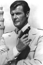 Roger Moore in 1970's Safari Jacket Holding Gun 24x18 Poster - $23.99