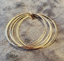 VINTAGE 70&#39;S SILVER TONE SEVEN ROW BANGLE BRACELETS - $30.00