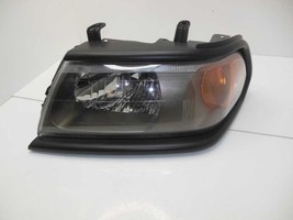 Driver Left Headlight Color-keyed Bezel Fits 00-04 MONTERO SPORT 524466F... - £90.02 GBP