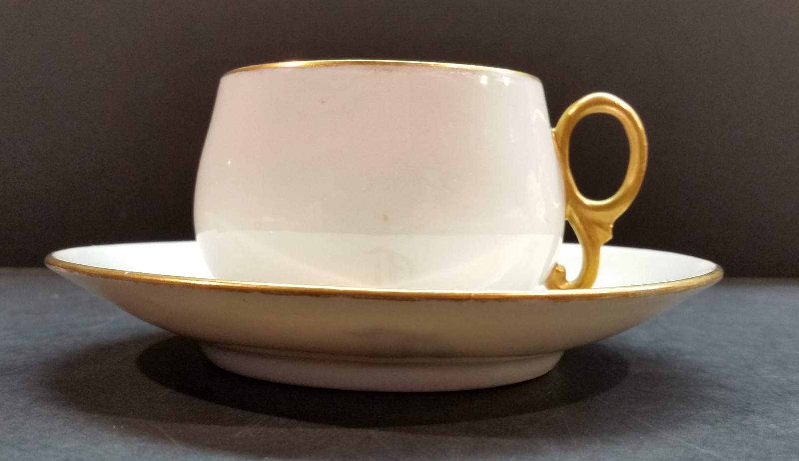 Limoges Gold Trim Cup and Saucer with “D” in gold on the saucer and marked “R D” - $40.00