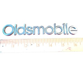 GM Oldsmobile 91-97 Cutlass Supreme Chrome Plastic Trunk Emblem OEM 16502255 - £9.35 GBP