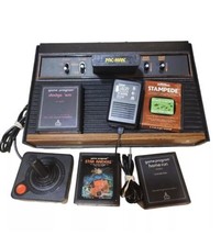 Atari 2600 4-Switch model Wood Grain NTSC games and accessories included... - $74.38