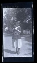 BLACK &amp; WHITE NEGATIVE * Woman carrying a small back dog - $9.85