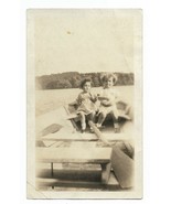 1926 4.5 x 2.75 inch photograph of two young girls in a rowboat on a lake - $371.04 MXN