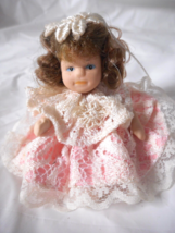 Vintage Hand Tied 2” Porcelain Doll Pink Lace Dress Brown Curly Hair Bloomers - £7.90 GBP