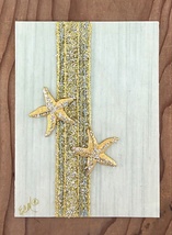 Two Golden Starfish with Sparkling Gold Ribbon on Sea Mist Greeting Card - $10.00