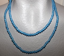 An item in the Crafts category:  GLASS BEADS TRANSPARENT BLUE 36" NECKLACE READY TO WEAR OR USE FOR YOUR CRAFTS