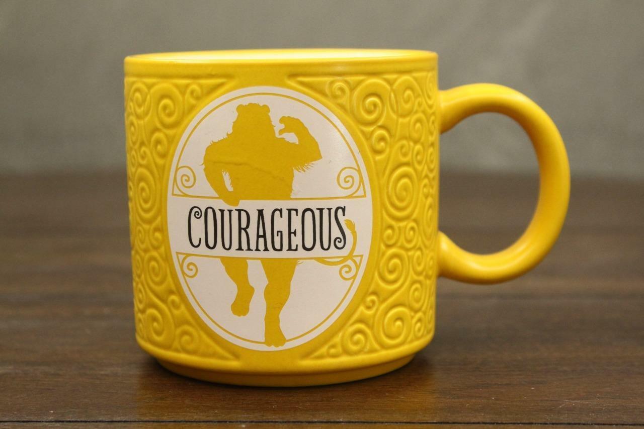 Primary image for Textured Wizard of OZ Cowardly Lion Yellow Coffee Mug COURAGEOUS by Hallmark