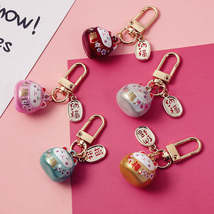 Cute Sakura-shaped Hollow Bell Ceramic Cat Blessing Blessing Handbag Pendant - £8.86 GBP