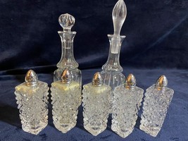 An item in the Pottery & Glass category: VINTAGE SET OF CRYSTAL CUT GLASS OIL AND VINEGAR DECANTERS WITH LID & SALT AN...