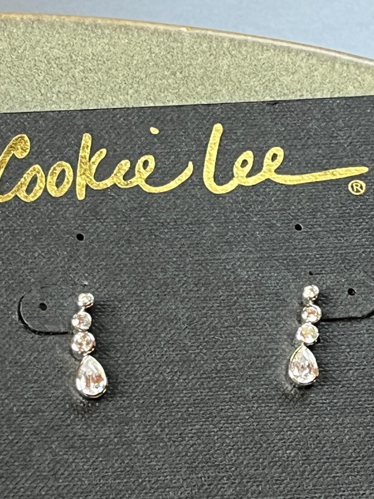 Cookie Lee Graduated Clear Rhinestone in Silvertone Frame Dangle Post Earrings - $11.29