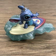 Disney Lilo &amp; Stitch Surfing the Wave  Christmas Holiday Tree Ornament K... - $259.97 MXN