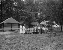 Children lined up for drinks at tuberculosis camp 1910 Photo Print - $8.81+