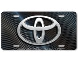 Toyota New Logo Inspired Art on Carbon FLAT Aluminum Novelty License Tag... - $17.99