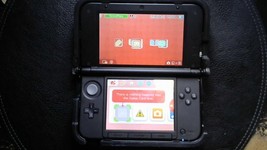 Nintendo 3DS Handheld System (Includes Nerf Armor Case and Mario Travel Bag) - $250.00
