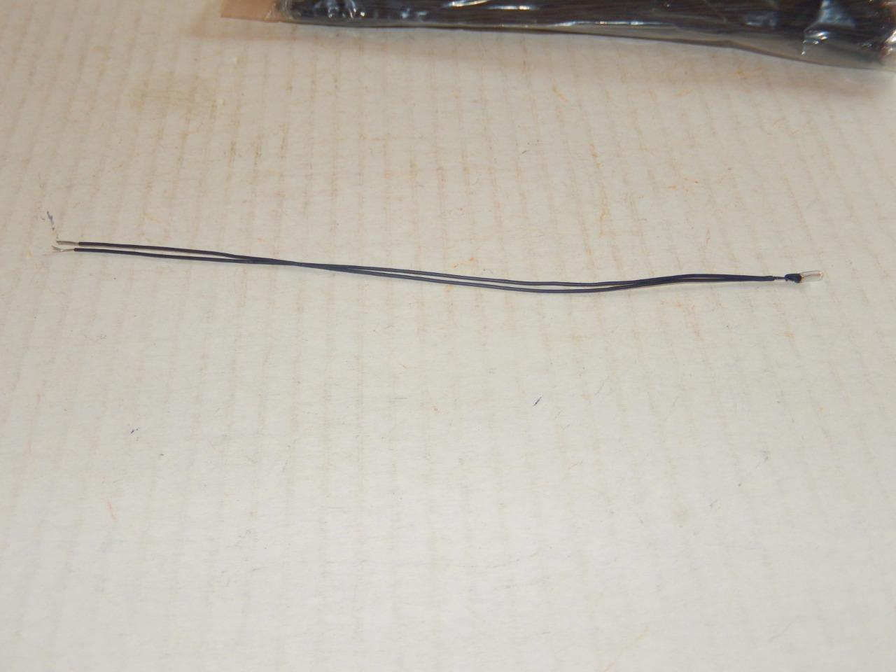 LIONEL PART -2312-009- GRAIN OF WHEAT BULB W/BLACK WIRE  - NEW- W79 - $1.13