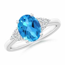 ANGARA Solitaire Oval Swiss Blue Topaz Ring with Trio Diamond Accents - £1,012.51 GBP