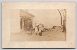 RPPC Family Pose At Farmhouse Stepback Cupboard On Real Porch Photo Postcard L27 - £11.95 GBP