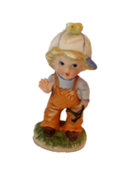 CERAMIC FIGURINE, CHILD WITH SLING SHOT 5 1/2" TALL - $3.00