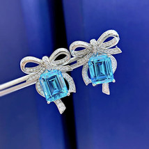 4Ct Emerald Cut Lab-Created Blue Topaz Stud Earrings 14K White Gold Plated - £112.10 GBP