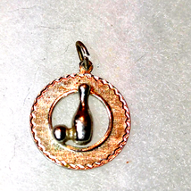 Decorated sterling silver bowling pendant - $436.59 MXN
