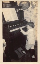 RPPC of boy playing a piano - £14.16 GBP
