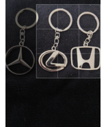 your choice keychains , Honda or Lexus - $148.18 MXN