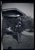 BLACK &amp; WHITE NEGATIVE * Man in uniform holding his rifle in front of house - $9.85
