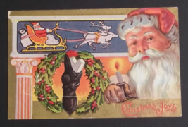 Christmas Joys Santa Sleigh Candle Wreath Stocking Gold Embossed Postcard c1910s - £7.70 GBP