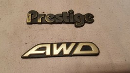 Subaru OEM &quot;Prestige&quot; and &quot;AWD&quot; Emblem Badge Logo Symbol Insignia Sign Bundle! - £16.37 GBP