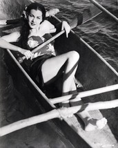 Maria Montez in Hawaiian style outfit lies in canoe 24x36 inch poster - $29.99