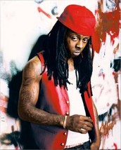 Lil Wayne in red sleeveless vest poses against wall 8x10 inch publicity photo - £11.79 GBP