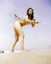 Raquel Welch 16x20 Poster on beach in bikini dancing - £15.73 GBP