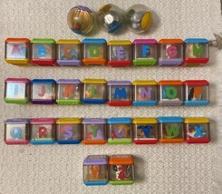Fisher  Price ALPHABET Peek-a-Boo Blocks - Letters A-Z, Three Roll-a-Rou... - $1,111.87 MXN