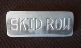 Aluminum paperweight &quot;Skid Row&quot; - $8.00