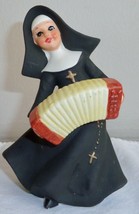 Napcoware Porcelain Nun Playing Accordion Figurine #7129 - $349.68 MXN