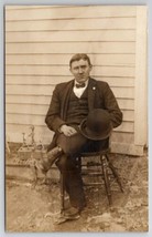 RPPC Handsome Gentleman With Bow Tie Seated In Yard For Photo Postcard M24 - £7.17 GBP