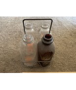 Vintage milk bottles and carrier four bottles Driftwood - $2,258.01 MXN