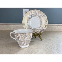 Queen Anne Gold Accented Floral Patterned Tea Cup And Saucer Set - $15.83
