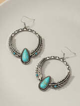 Boho distressed feather circle earrings - €8,43 EUR