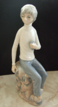 CASADES SPAIN PORCELAIN FIGURINE BOY SEATED ON ROCKS HOLDING PHONE 9&quot; TALL - £21.58 GBP