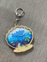 Retro sea friends scallop sand keychain - $479.16 MXN