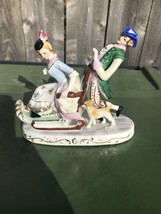 Vintage Occupied Japan Colonial Courting porcelain figurine. Man Woman Dog Sled - £39.56 GBP